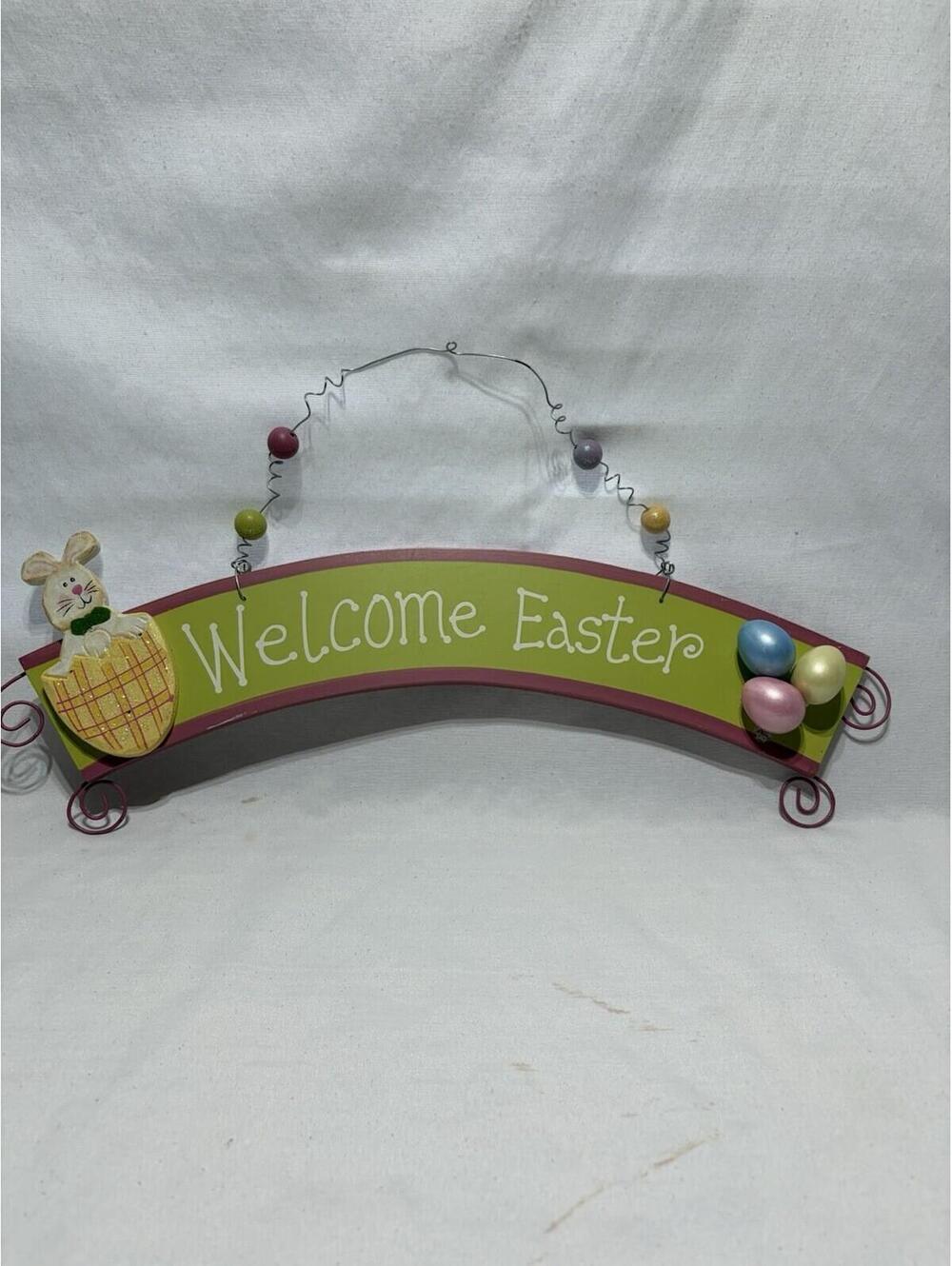 Easter wall sign featuring a bunny in a basket and colorful eggs